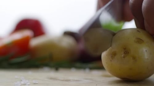 Cutting Piece of Raw Potato