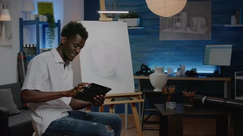 African American Creative Artist Using Digital Tablet