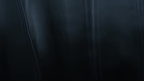 Abstract Dark Background with Flowing Light Streaks