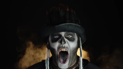 Man with Skull Makeup and Tall Hat Screaming