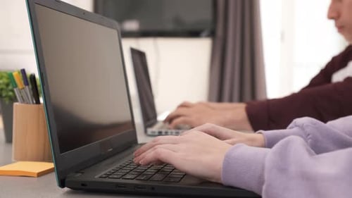 Focused Young freelancer couple sitting at desk working at home. Freelance, home office, remote work