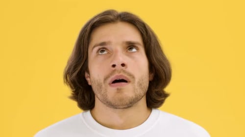 Adult male gesturing and talking with frustration