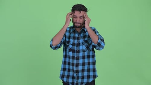 Man Massaging Temples to Relieve a Headache