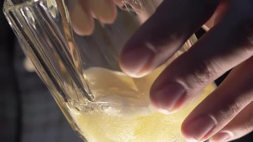 Beer Being Poured into a Fluted Glass