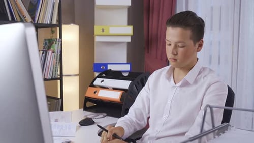 Young Adult Working at Desk