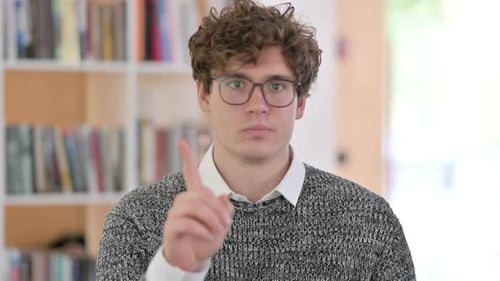 Young Adult With Curly Hair Saying No