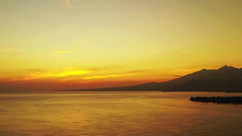 Aerial drone scenery of paradise coast beach lifestyle by shallow ocean and bright sandy background