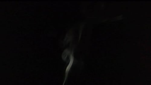 Abstract White Smoke Swirling on Black Background
