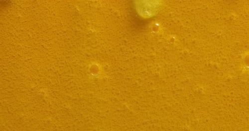 Abstract Viscous Orange Liquid Textured Macro Shot