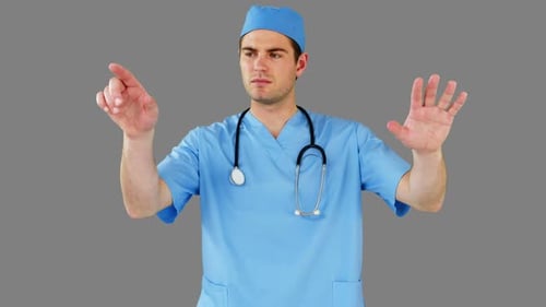 Surgeon pretending to be using futuristic digital screen