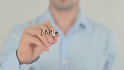 Writing Investment Growth with Marker on Clear Surface