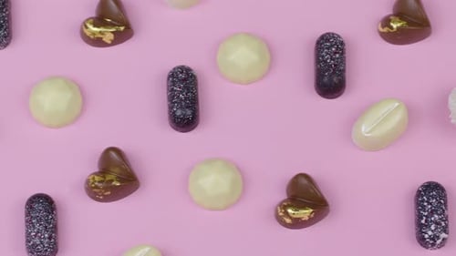 Pink Chocolate Conveyor Carrying Exquisite Delicious Handmade Chocolate Sweets