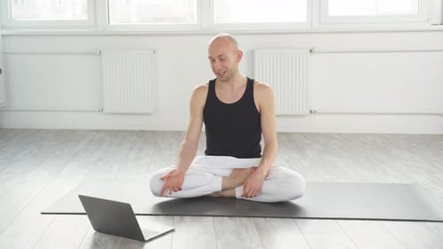 Man on Video Call Demonstrating Yoga Position