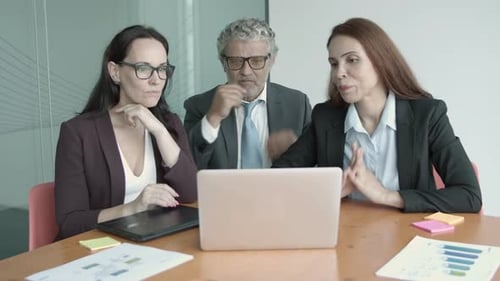 Business Meeting with Laptop in Bright Modern Office