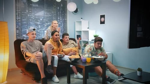 Friends Watch Sports Game Together in Living Room