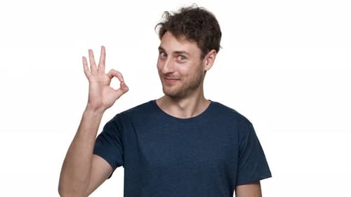 Smiling Man Gives Okay Hand Gesture