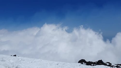 timelapse of fast moving clouds near the volcano Etna on the island of sicily in Italy, sunny weathe
