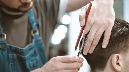 Man Getting Haircut at Barbershop