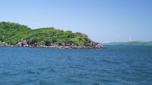 Amazing View of Blue Seascape and Green Rocky Island From a Moving Boat.