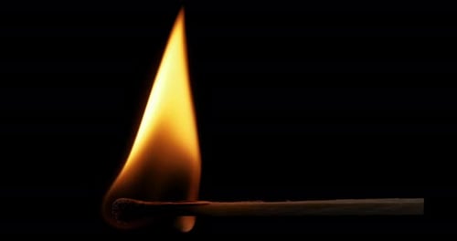 Close Up of a Matchstick Igniting into Flame