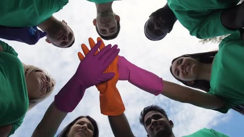 Diverse Volunteers Teamwork with Hands Together Skyward