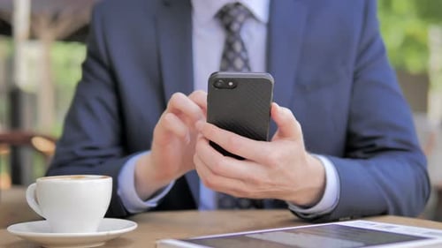 Close Up of Businessman Using Smartphone, Outdoor