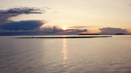 Onega Lake and Islands with Flying Birds at Sunset
