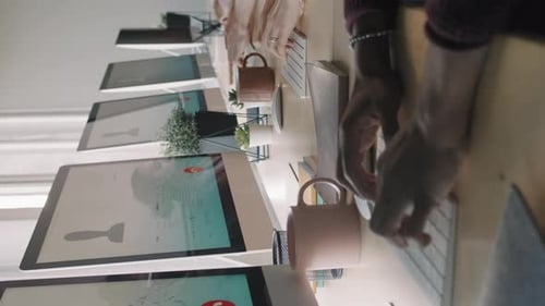 Vertical Shot of Busy Call Center Workers