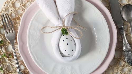 Festive Easter Table Setting with Bunny Napkin Decoration