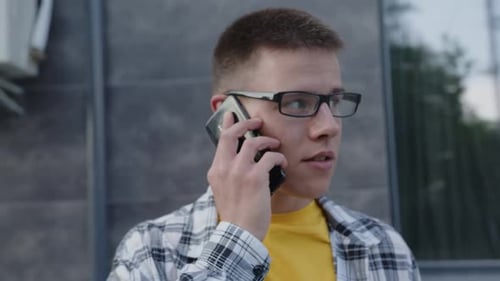 Man is Talking on His Phone