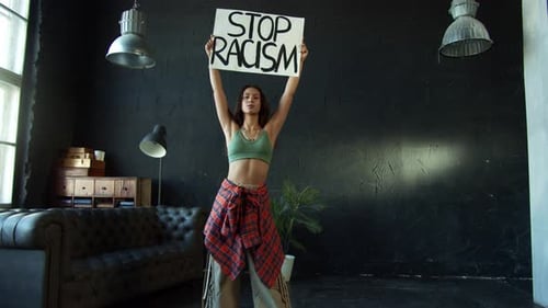 Young Adult Protesting Against Racism in Indoor Setting
