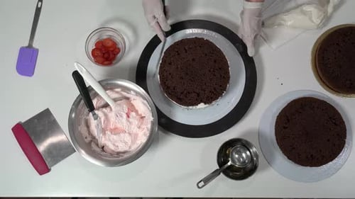 Chocolate Cake Assembly on Clean White Tabletop