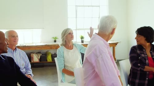 Diverse Group of Seniors Meeting Indoors