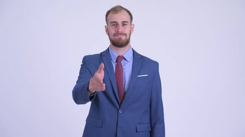 Happy Bearded Businessman Giving Handshake