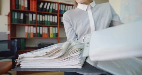 Close Up. Female Hands of Office Worker or Accountant. Open Document Folder.
