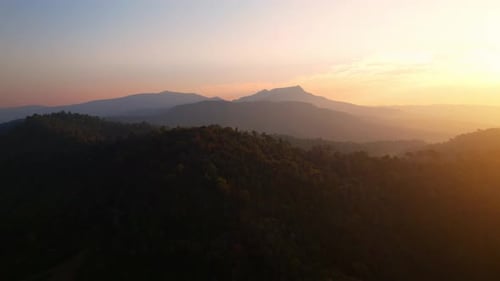4K Aerial view over the mountains at sunset. Drone Flight Footage