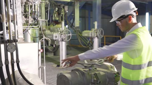 Opening valve in industrial factory.