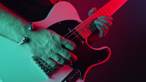 Rock Guitarist Man on Smoky Stage Masterfully Playing Electrical Guitar