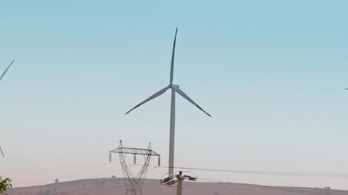 Wind Turbines Spinning in a Rural Landscape