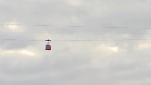 Barcelona Port Vell Cable Car Cabins Leaving Torre Jaume I in Barcelona Spain