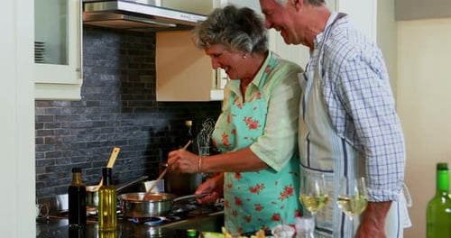 Senior Couple Cooking Together at Home