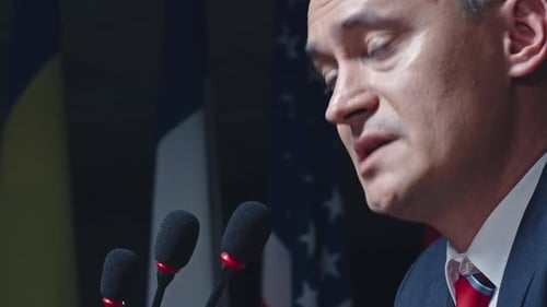 Adult Man Speaks at Corporate Press Conference