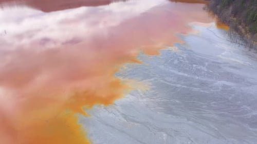 Flying Over Contaminated Water With Cyanide Mixing Into Artificial Lake