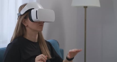 Young Woman Using VR Headset at Home