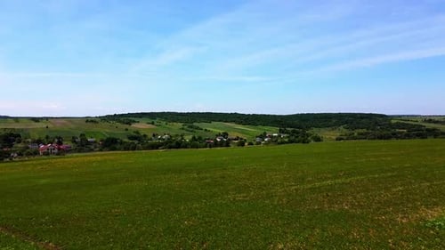 Aerial drone view of a flying over the rural agricultural landscape.