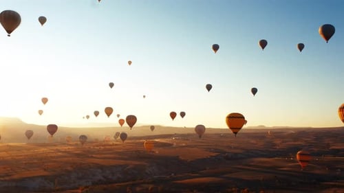 Hot Air Balloons Float Over Cappadocia at Sunrise