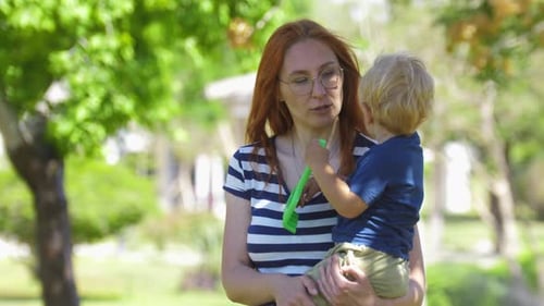 Mother and Child Enjoy Sunny Day at the Park