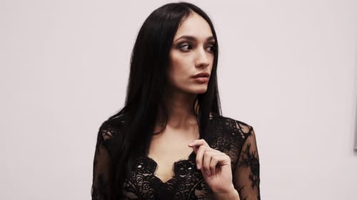 Young Woman Posing in Black Lace Top