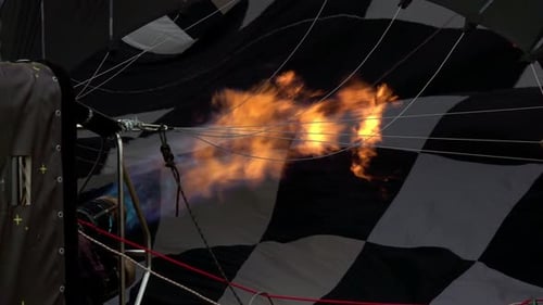 Flame Inflating Checkered Hot Air Balloon