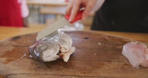 Chef Prepares Fresh Fish Fillet on Board